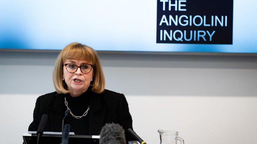 Dame Eilish Angiolini with medium-length fair hair and glasses sitting in front of a microphone