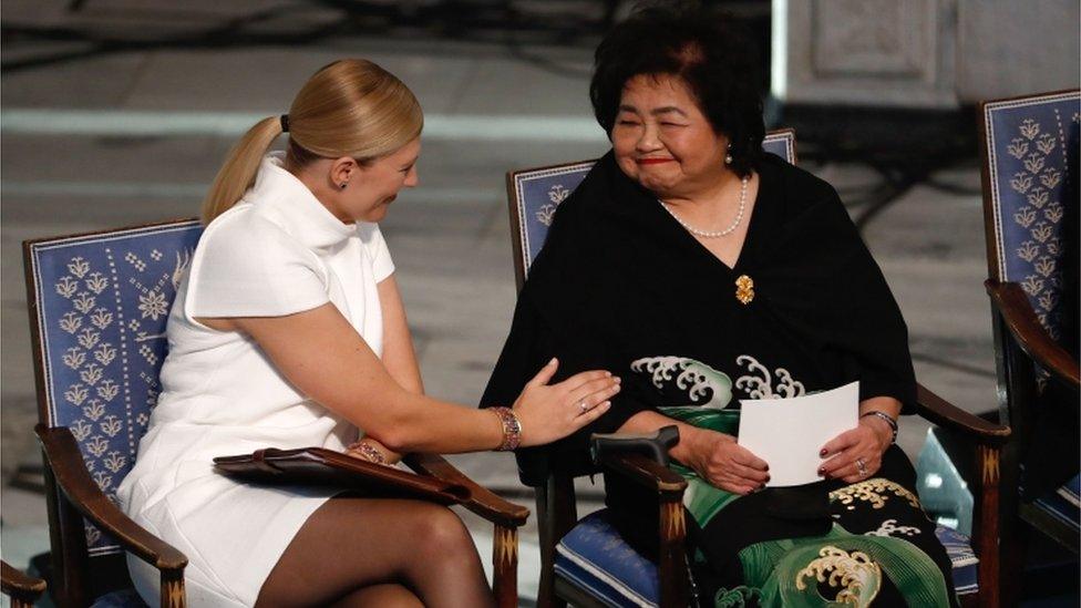 Beatrice Fihn (left), leader of Ican, talks with Hiroshima nuclear bombing survivor Setsuko Thurlow at the city hall in Oslo, Norway, during the award ceremony of the 2017 Nobel Peace Prize, 10 December 2017