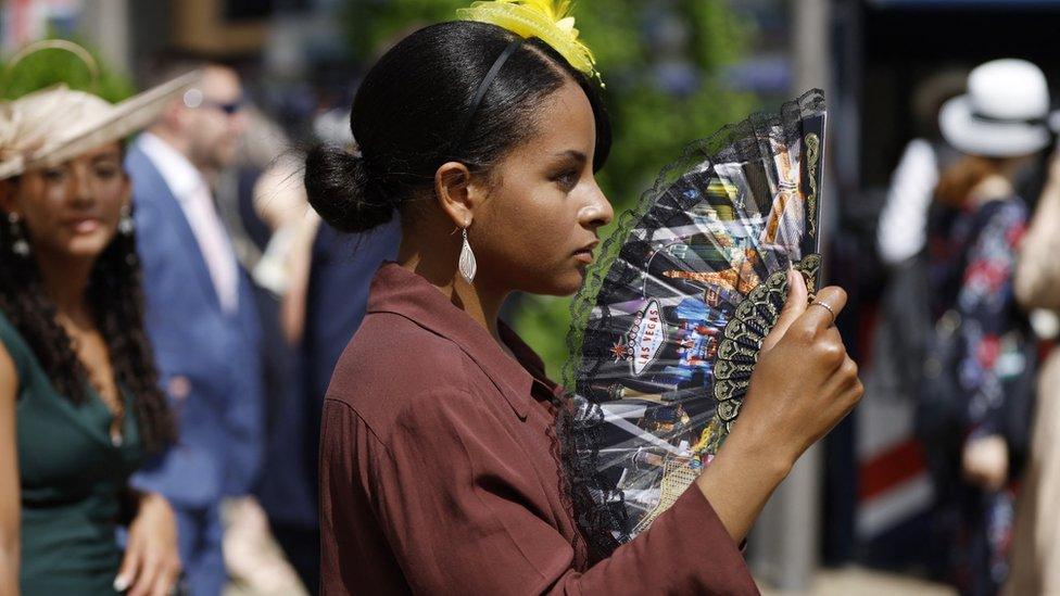 A woman with a fan