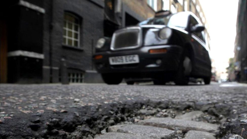 Pothole in road