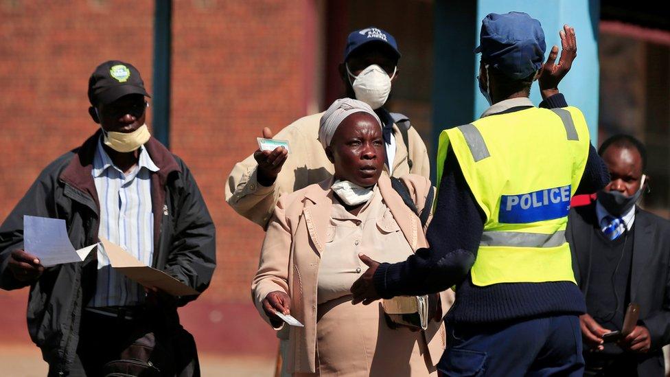 A policewoman turns away people from the city centre ahead of planned anti-government protests during the coronavirus disease (COVID-19) outbreak in Harare, Zimbabwe, July 30, 2020.