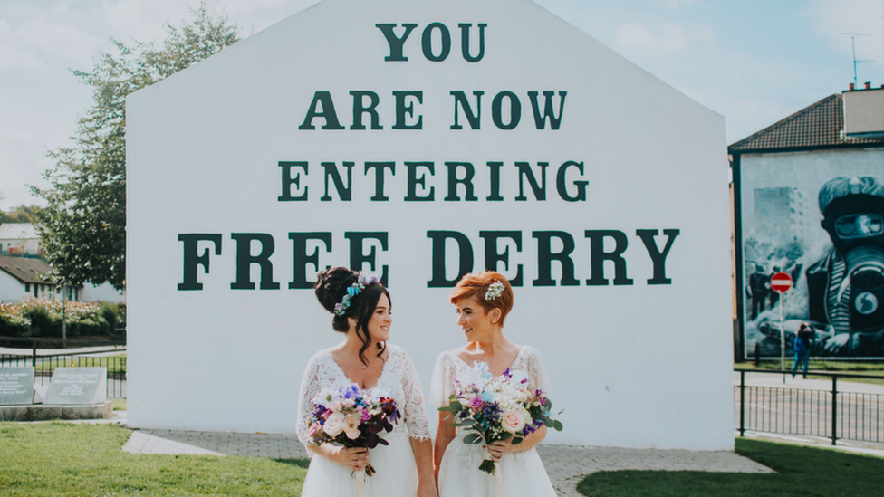 Danielle Doherty and Emma Bradley standing outside Free Derry corner