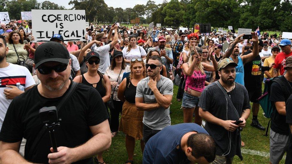 Protesters gather during an anti-vaccination rally in Melbourne, Australia, 20 February 2021.