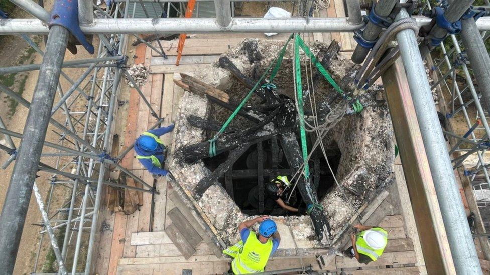 Abseilers retrieve the church bells