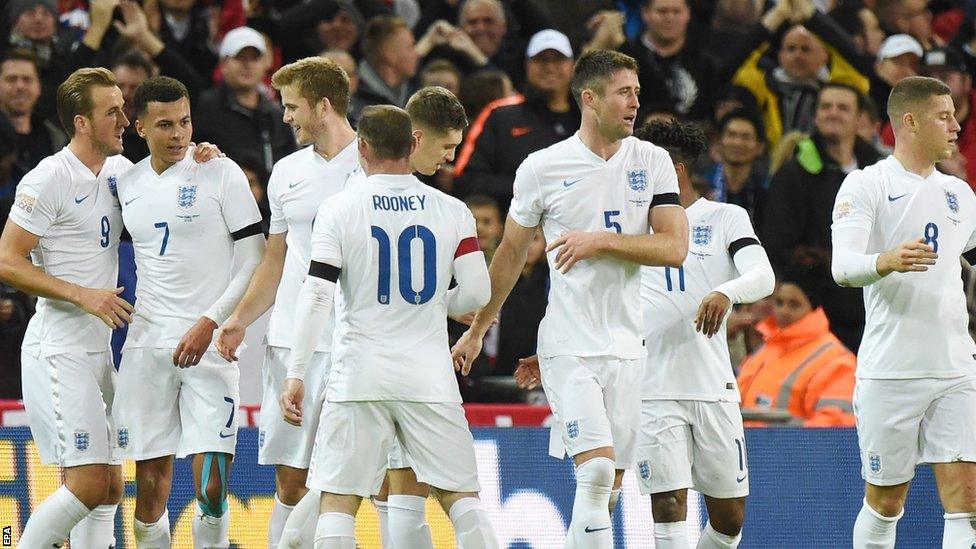 Deli Alli is congratulated by team mates