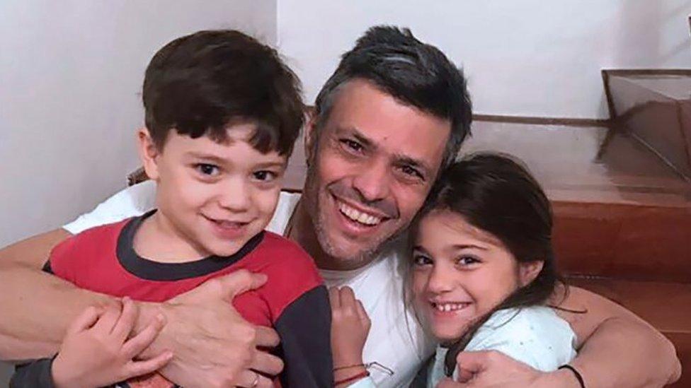 Venezuelan opposition leader Leopoldo Lopez hugging his children at his house in Caracas after his release from prison (08 July 2017)