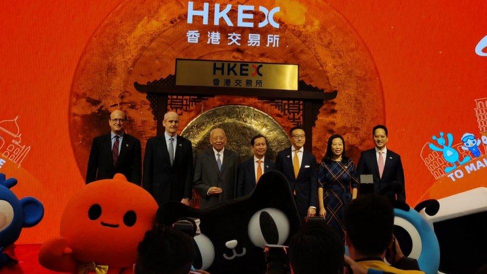 Alibaba chairman Daniel Zhang in the centre of a picture of Alibaba executives adn Chinese officials at the Hong Kong stock exchange