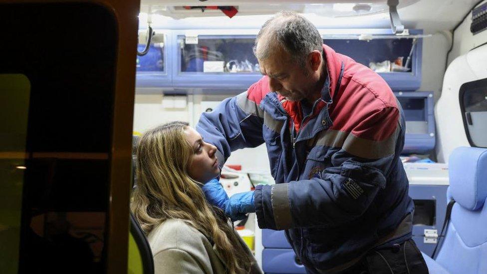 A medic treats a passenger, after two trains collided, near the city of Larissa, in Thessaloniki, Greece, March 1, 2023.