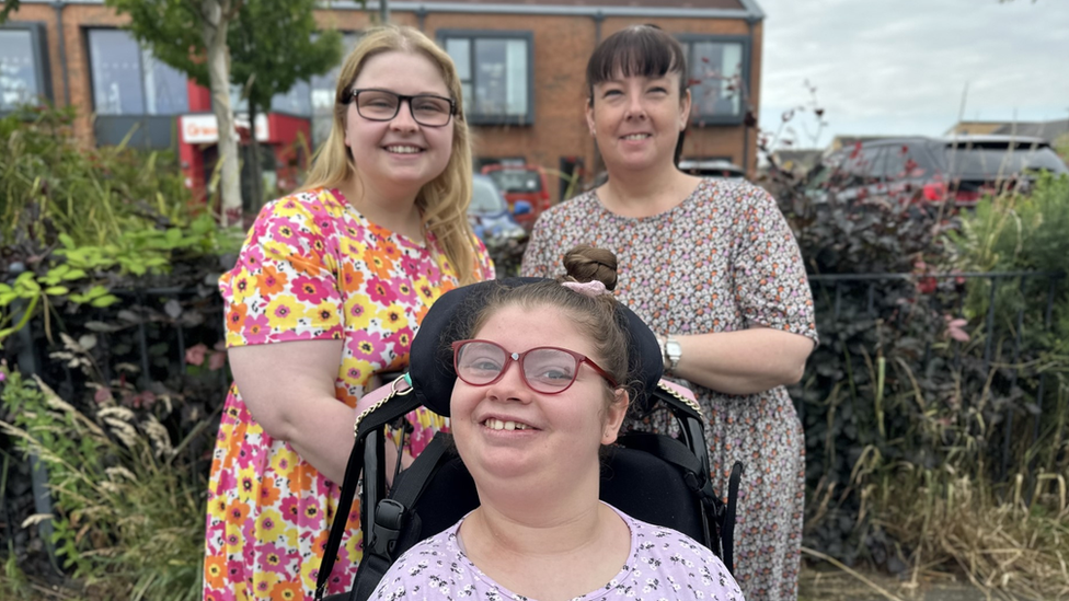 Tracy Cruddas, with Amy, left, and Katie, front