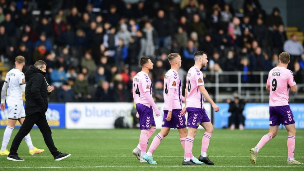 Bromley FC and Yeovil Town FC players leaving the pitch