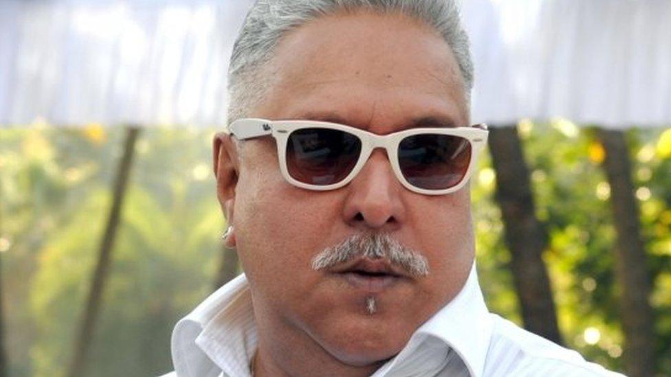 his file photo taken on December 21, 2013 shows Indian liquor baron Vijay Mallya at the launch of the Kingfisher 2014 calendar in Mumbai.