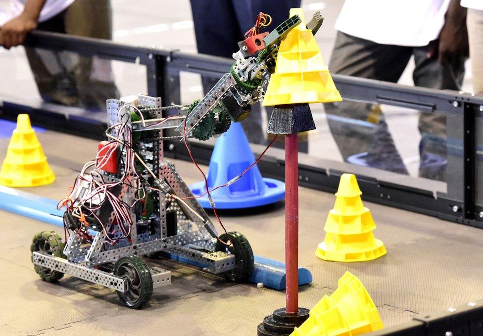A robot performs during the final of the national robotics competition on May 20, 2017 at the Marius Ndaye stadium in the Senegalese capital Dakar