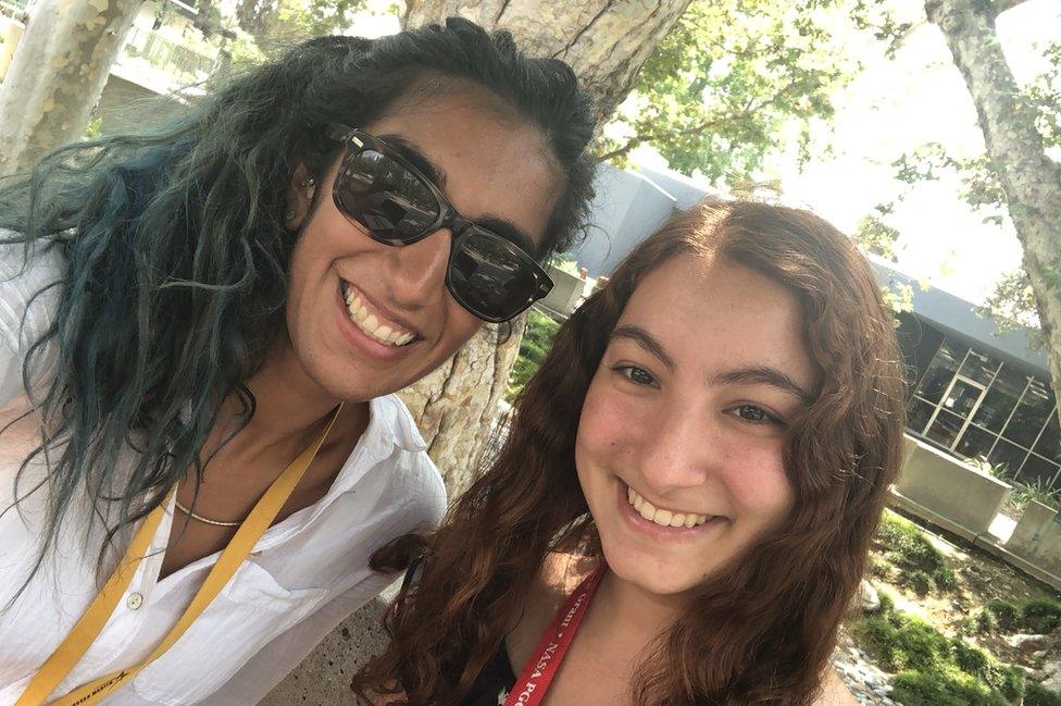 Dr Alibay and a JPL intern are both facing the camera, smiling