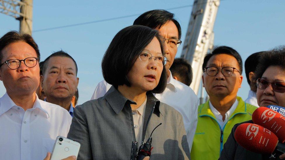 Taiwan"s President Tsai Ing-wen (C) speaks after a briefing at Xinma station in Taiwan's northeastern Yilan county