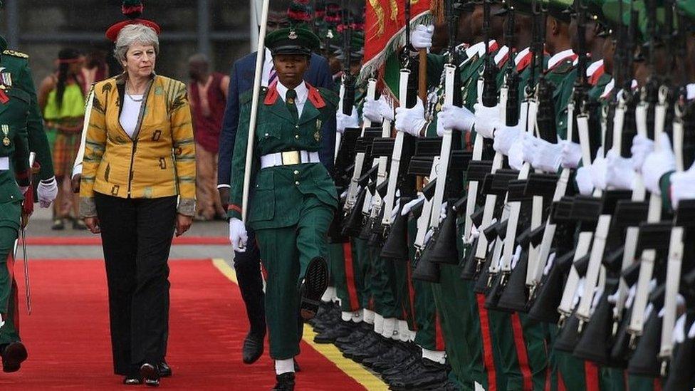 Theresa May arriving in the Nigerian capital of Abuja