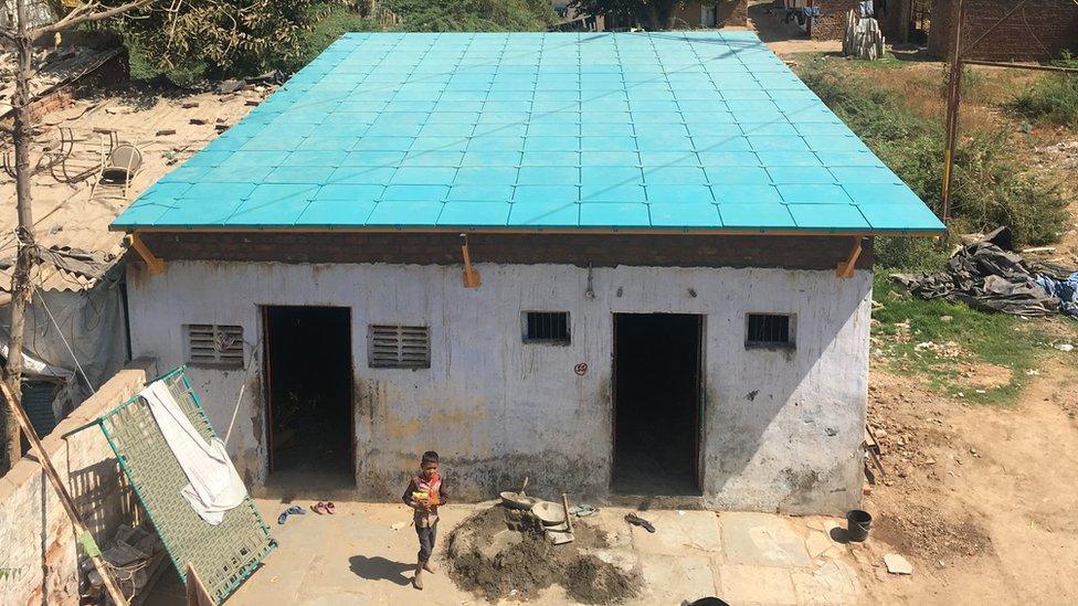 Large blue roof on stone building