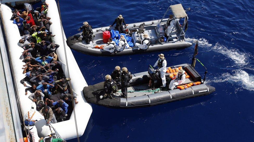 German and Finnish forces help migrants to board the German combat supply ship Frankfurt am Main, 29 Mar 16