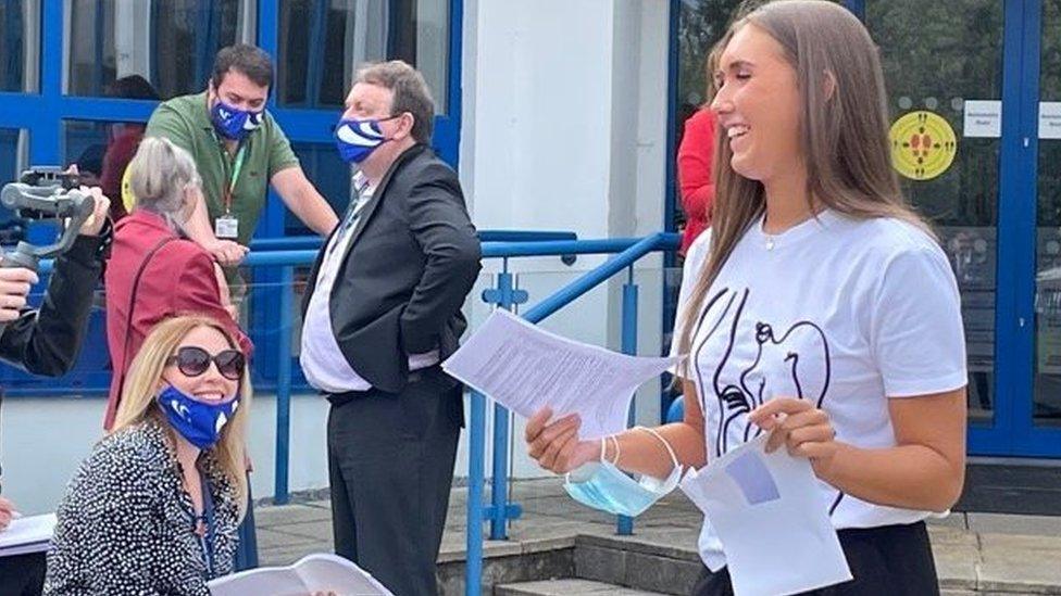 A student celebrating her results on Tuesday