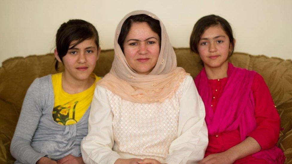 Koofi with her two daughters in 2012