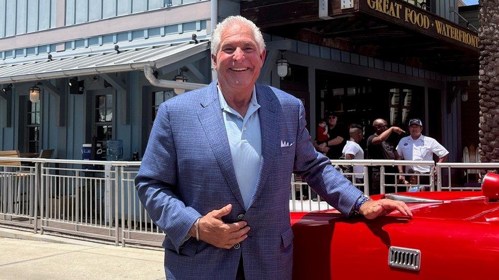 Steve Schussler outside one of his venues at Disney Springs