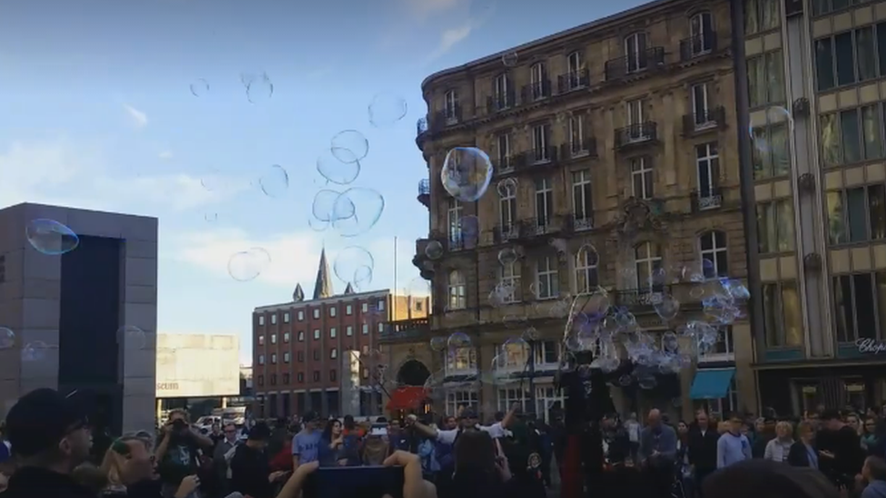 A still from a video of the bubble flash mob