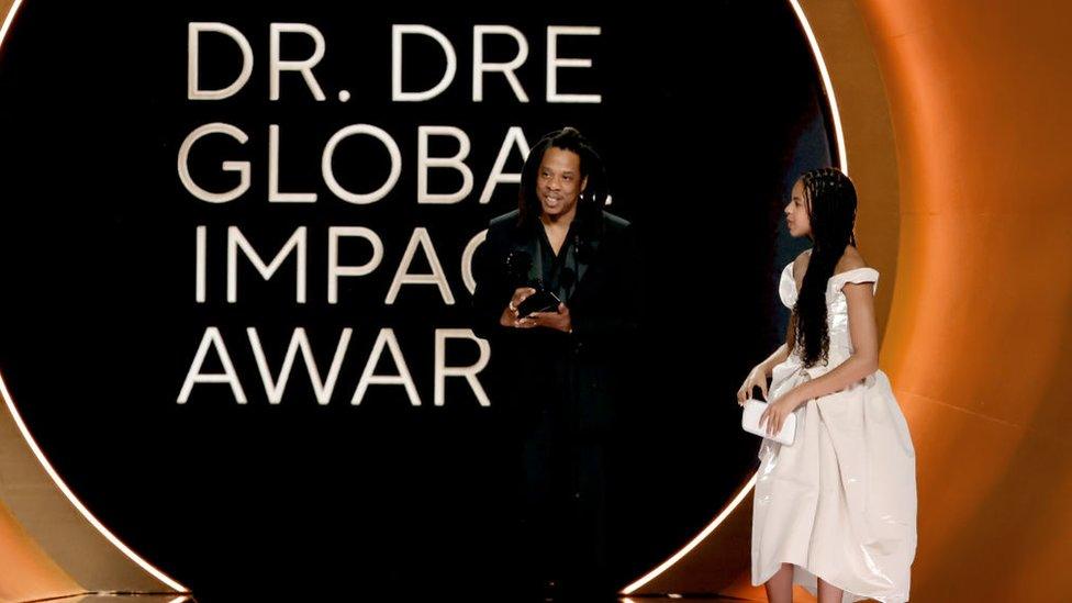 jay z and blue ivy on stage together as jay z accepts grammy award