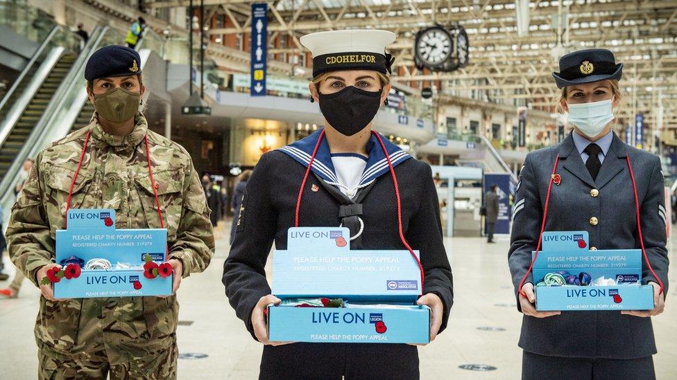 People selling poppies