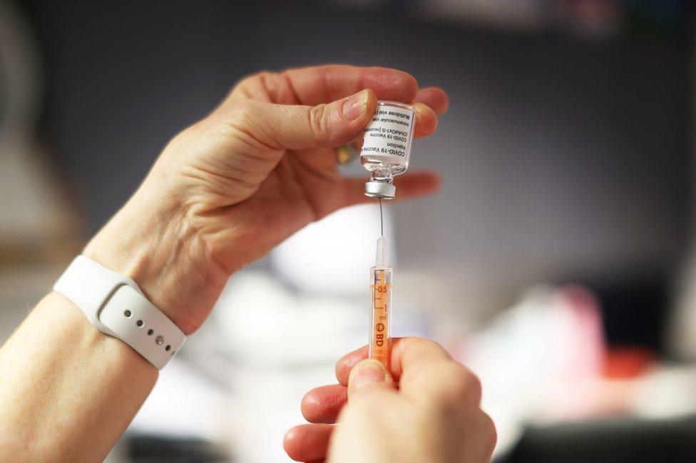 A nurse preparing a Covid-19 vaccine at a GP surgery in Belfast