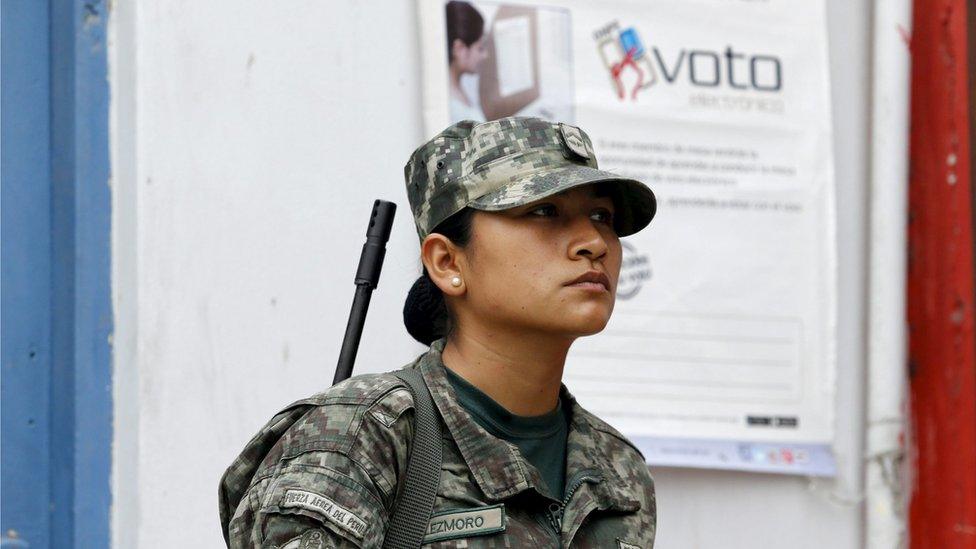 Peruvian soldier patrol a polling station after workers of Peru"s National Office of Electoral Processes (ONPE) leave voting materials, in Surco