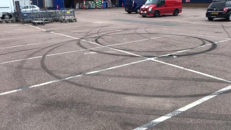 Skidmarks on a car park