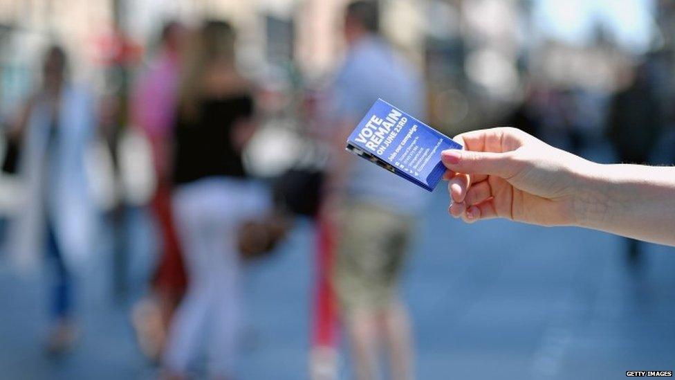 Man handing out Stronger In leaflet