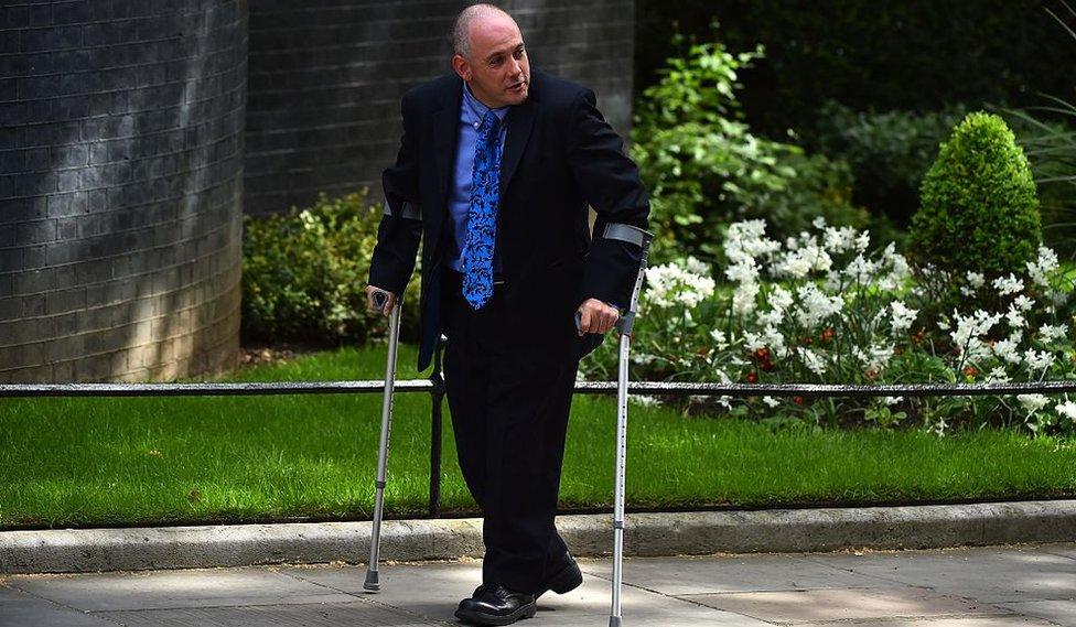 Conservative member of parliament Robert Halfon arrives for a meeting at 10 Downing Street in central London on May 11, 2015