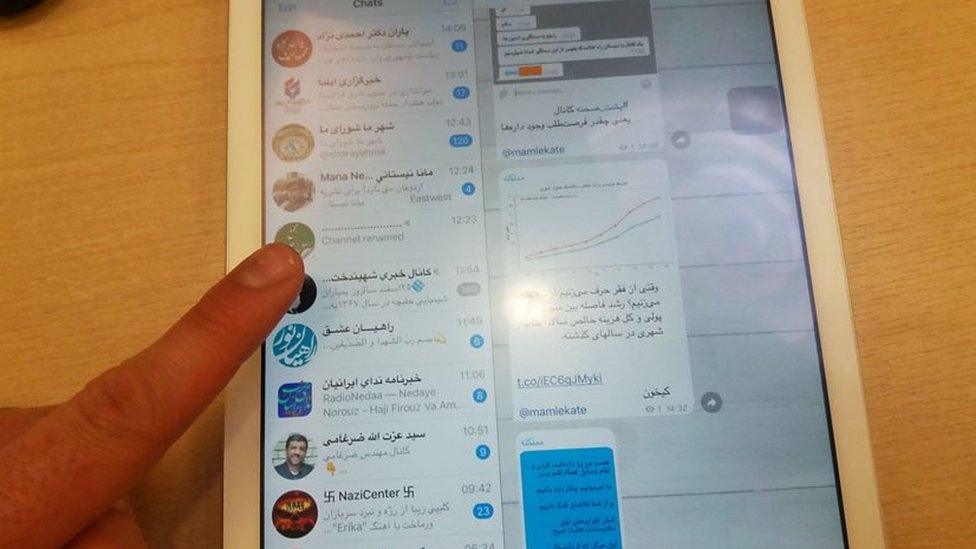 A tablet showing several different Iranian Telegram channels