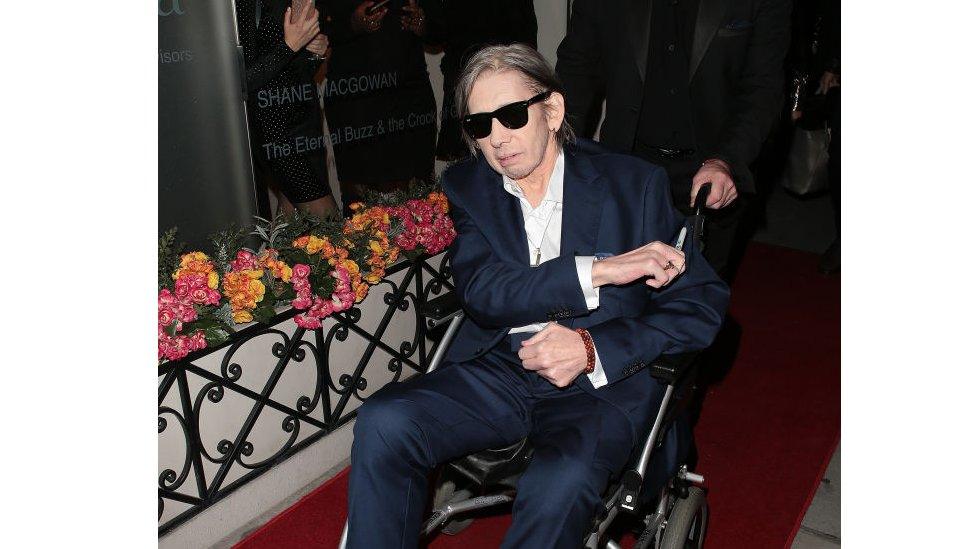 Shane MacGowan in a wheelchair