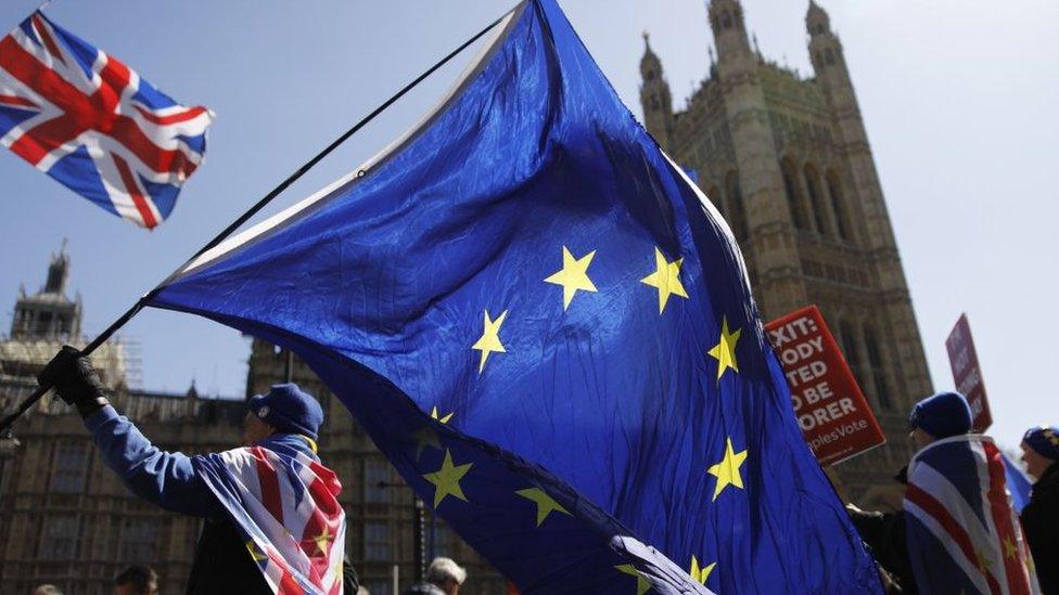 The EU and union flag outside Parliament