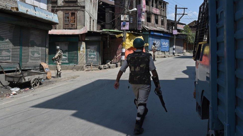 Indian paramilitary troopers patrol near the Jamia Masjid mosque in Srinagar on September 15, 2017