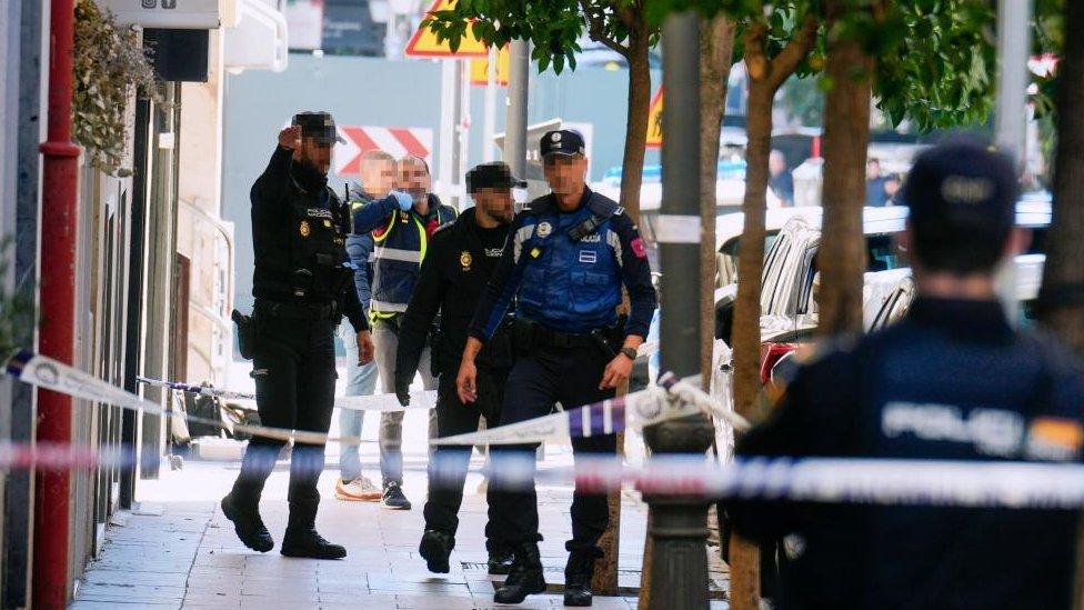 Police members inspect the area after former president of the People's Party of Catalonia and Former Vice-President of the European Parliament, Alejo Vidal-Quadras, was shot in the face