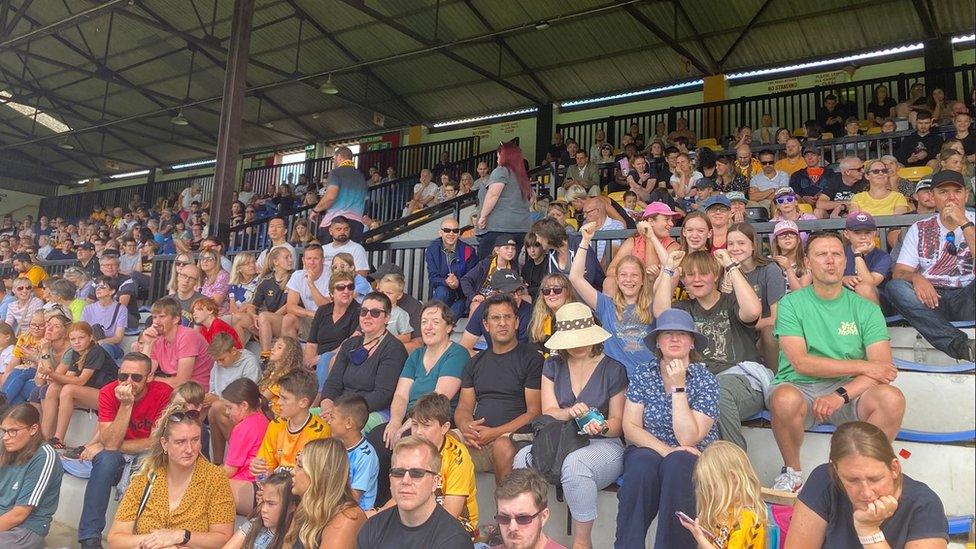 Crowd watching football match