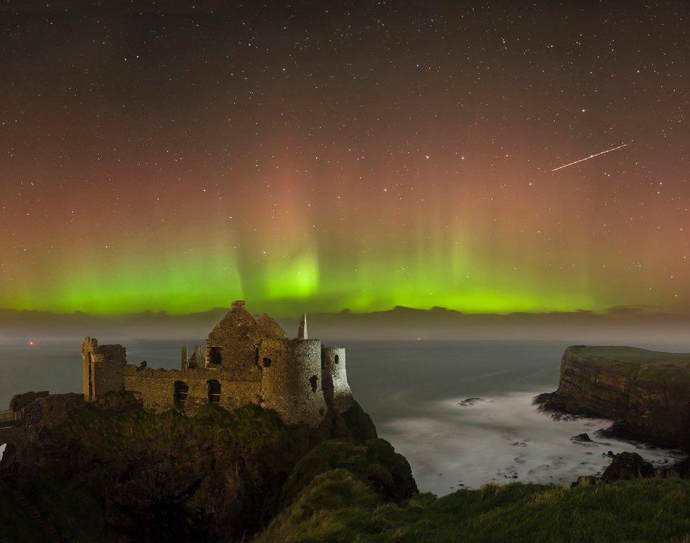 The aurora borealis above Dunluce Castle in County Antrim