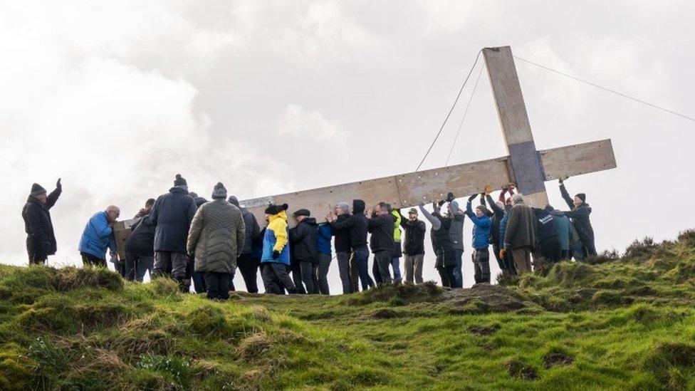 Chevin Cross being raised