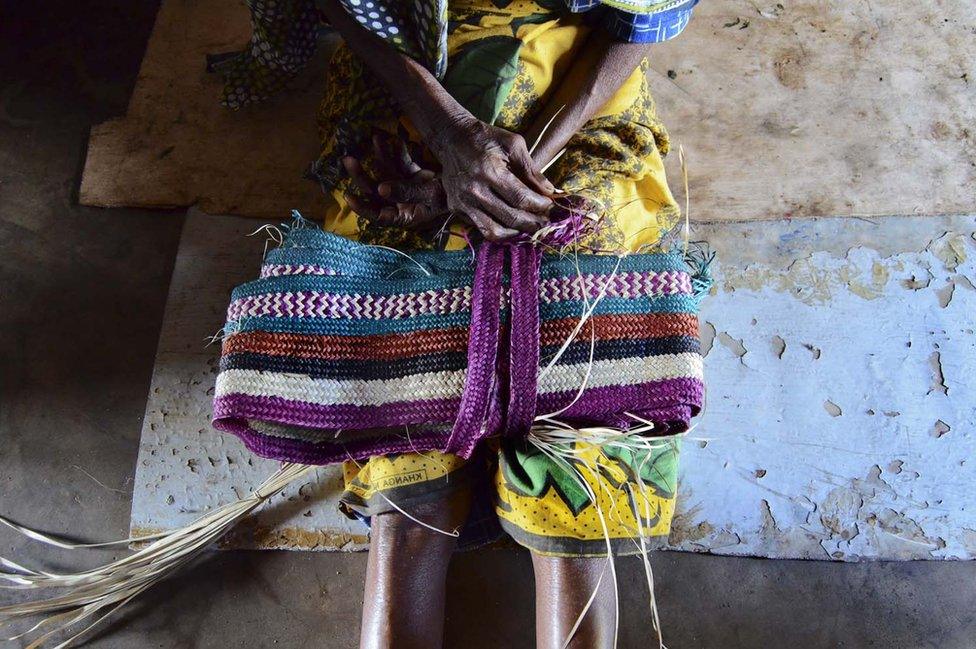 A woman's hands with a bag