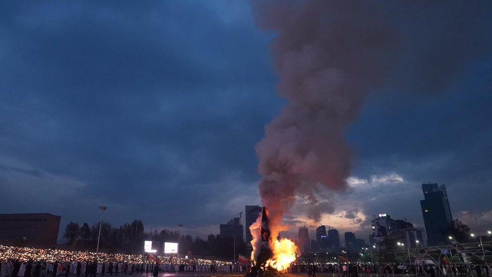 Smoke rising from a bonfire