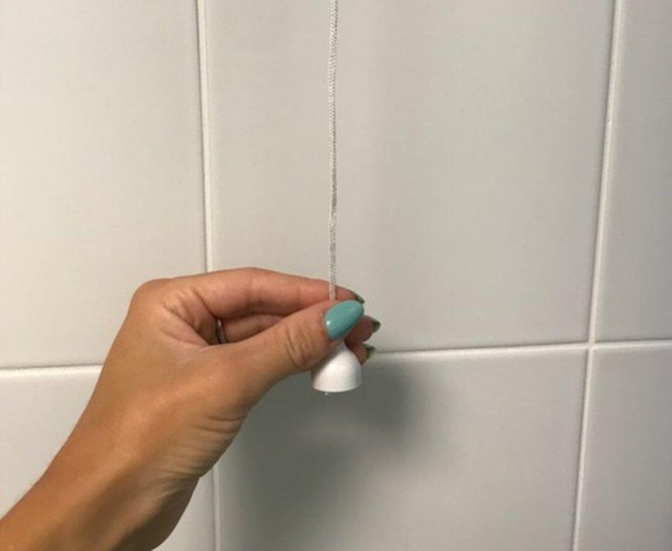 A pull cord in a bathroom