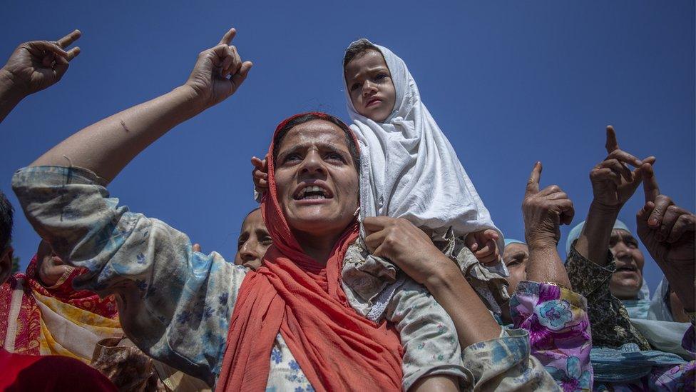 A woman and child at the demonstration in Srinagar