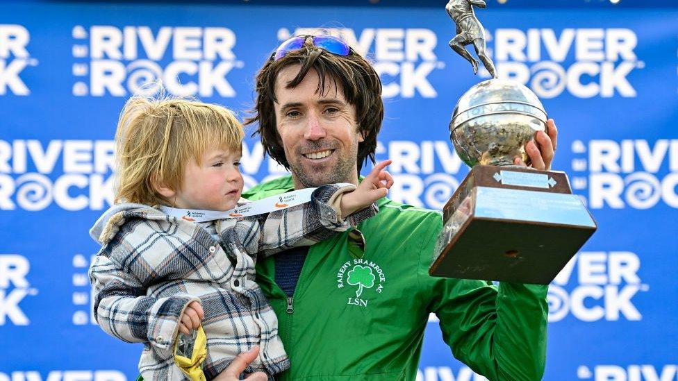 Mick Clohisey and his son Paul celebrate his marathon win