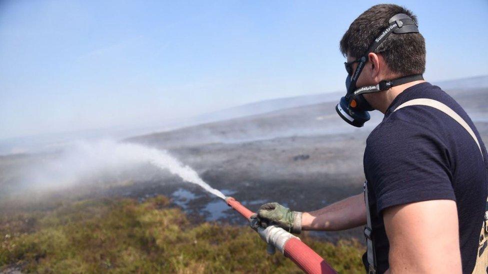 Firefighter tackles the blaze