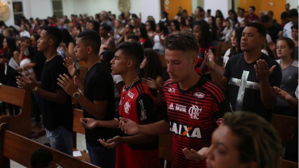 Mourners at a memorial mass, Rio de Janeiro, 8 February 2019