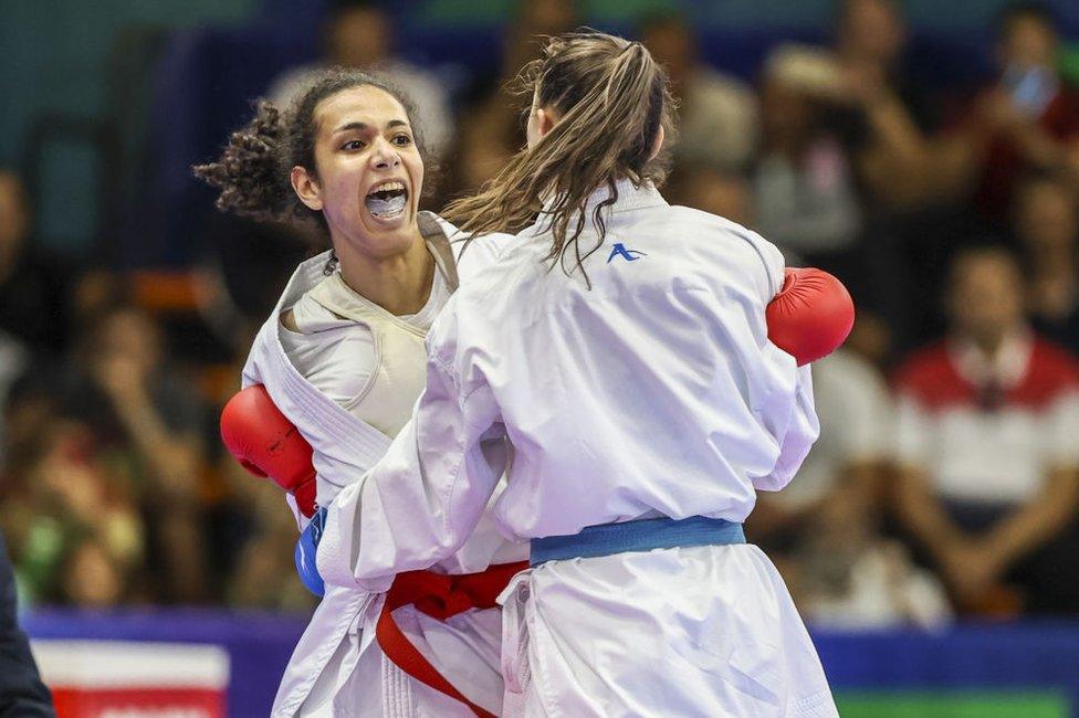 ORAN, ALGERIA - JUNE 26: Ouikene Cylia (R) of Algiers in action against Salama Reem (L) of Egypt during the Kumite women's 50kg gold medal match within the 19th Mediterranean Games in Oran, Algeria on June 26, 2022