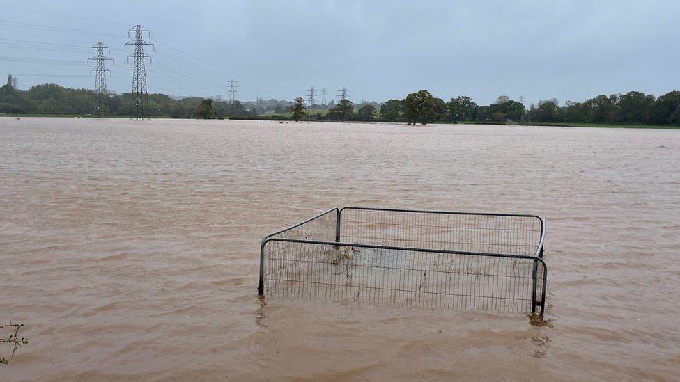 Flood water covers a field after the River Clyst overflowed in Clyst Saint Mary, near Exeter.