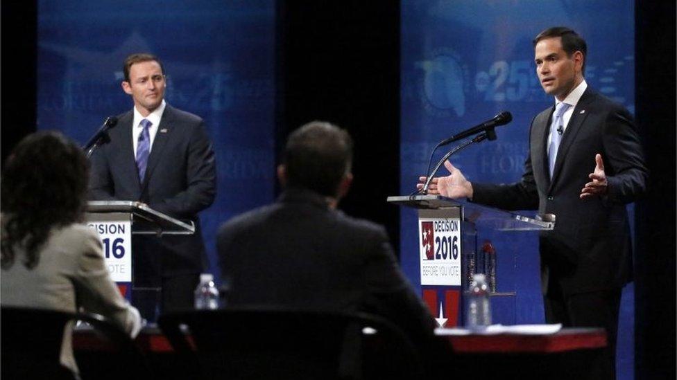 Senator Marco Rubio, right, gestures as he and Representative Patrick Murphy, left, answer questions from a panel during a debate.